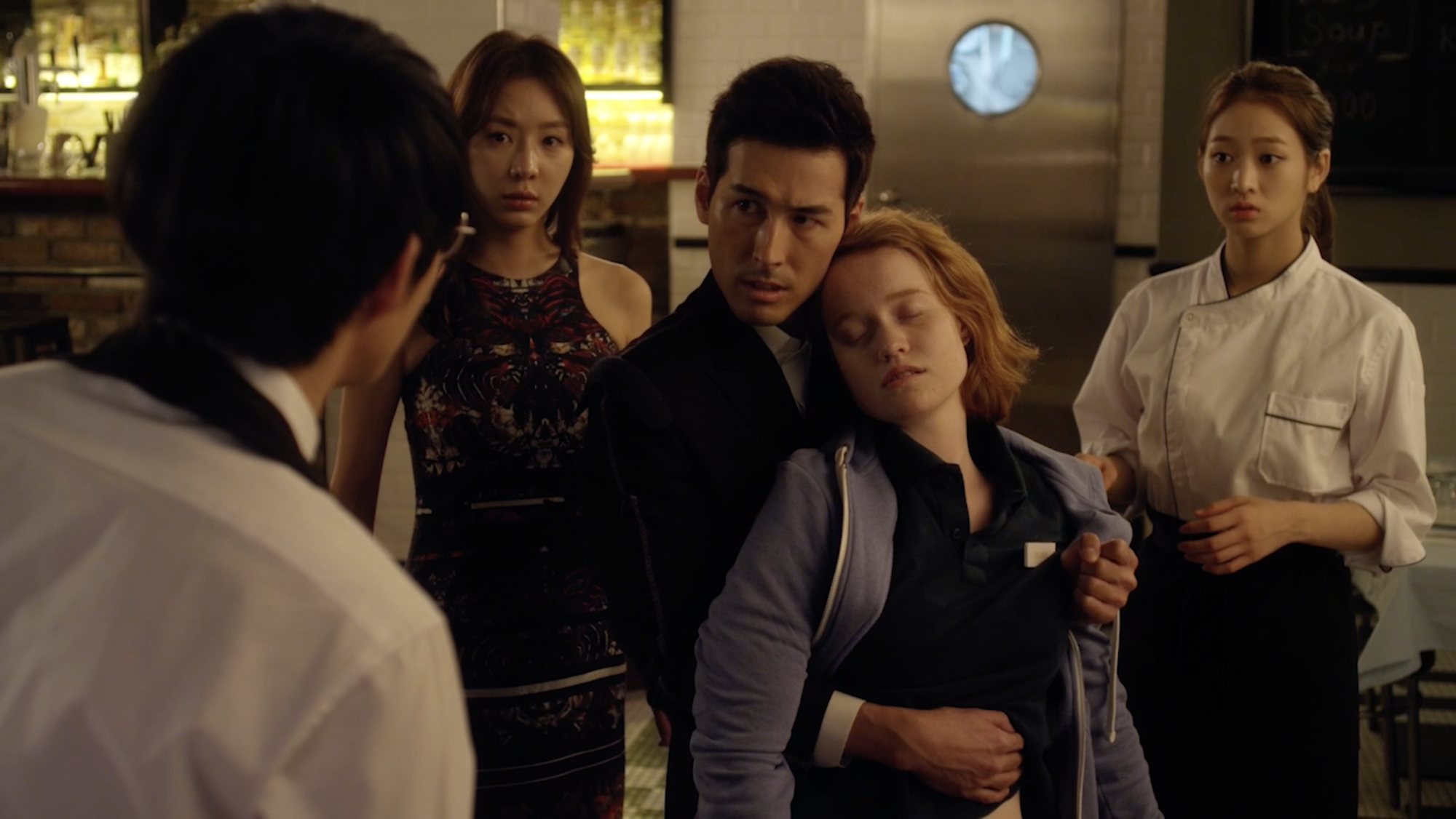 The male lead holds a fainted Claire as the other characters stare